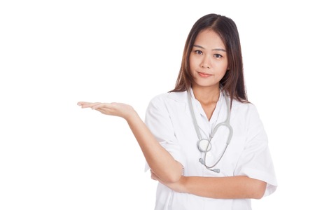 Asian young female doctor show something on her hand  isolated on white backgroundの写真素材