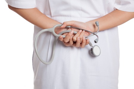 Close up of doctor hold stethoscope on the back  isolated on white backgroundの写真素材