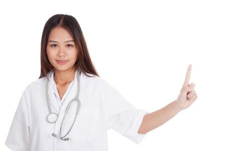 Asian young female doctor point to blank space  isolated on white backgroundの写真素材