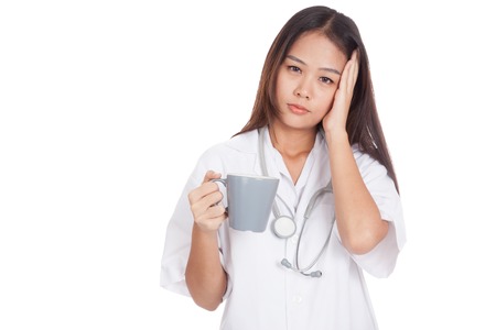 Asian young female doctor got headache  isolated on white backgroundの写真素材