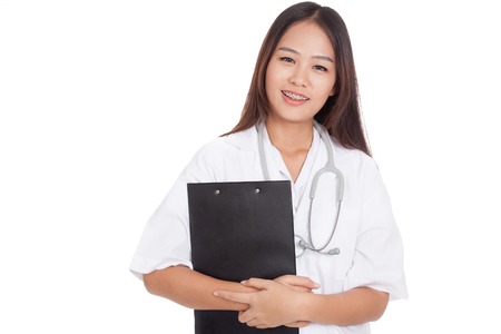 Asian young female doctor smile with a clipboard  isolated on white backgroundの写真素材
