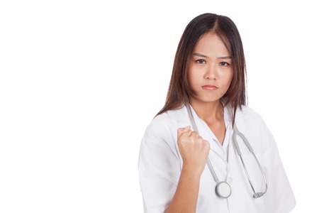 Portrait of confidence young female doctor hold fist  isolated on white backgroundの写真素材
