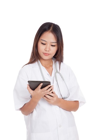 Asian young female doctor use a tablet pc  isolated on white backgroundの写真素材