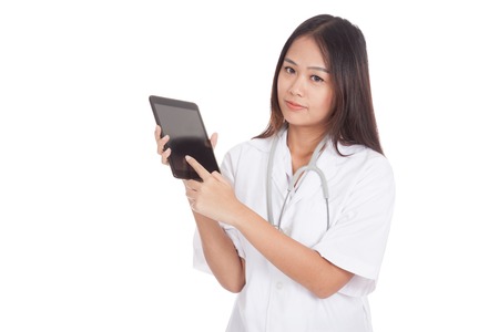 Asian young female doctor touch screen on tablet pc  isolated on white backgroundの写真素材