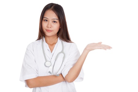 Asian young female doctor show something on her hand  isolated on white backgroundの写真素材