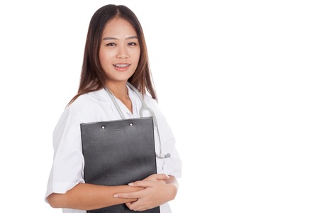 Asian young female doctor with a clipboard  isolated on white backgroundの写真素材