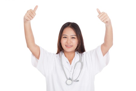 Young Asian female doctor show  two thumbs up  isolated on white backgroundの写真素材