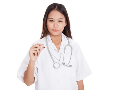 Young Asian female doctor with a red marker  isolated on white backgroundの写真素材