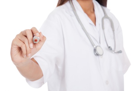 Young Asian female doctor with red marker focus at marker  isolated on white backgroundの写真素材