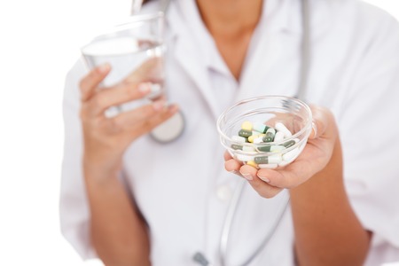Close up of doctor with water and medicineの写真素材
