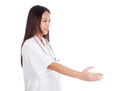 Young Asian female doctor greeting shaking hand  isolated on white backgroundの写真素材