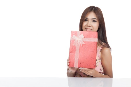 Beautiful Asian woman with red gift box  isolated on white の写真素材