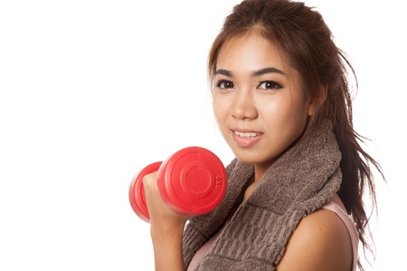 Asian healthy girl workout with dumbbell  isolated on white の写真素材
