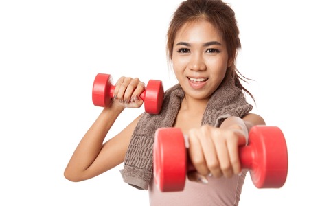 Asian healthy girl workout with dumbbell  isolated on white の写真素材