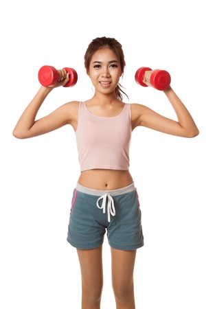 Asian healthy girl workout with dumbbell  isolated on white の写真素材