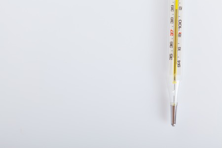 Close up of glass tube and mercury thermometers on white backgroundの写真素材