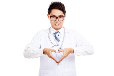 Asian male doctor show heart hand sign  isolated on white backgroundの写真素材