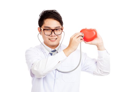 Asian male doctor check red heart with stethoscope  isolated on white backgroundの写真素材
