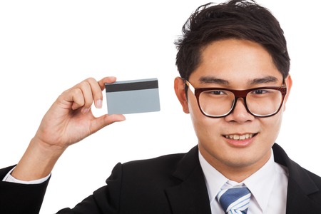 Asian businessman show a credit card  isolated on white backgroundの写真素材