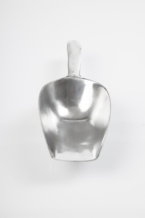 Aluminum alloy transfer scoop on white backgroundの写真素材