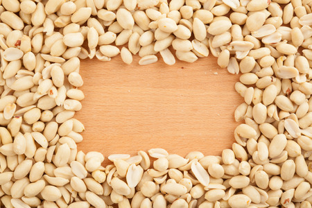 Top view of peeled peanuts with rectangular copy spaceの写真素材