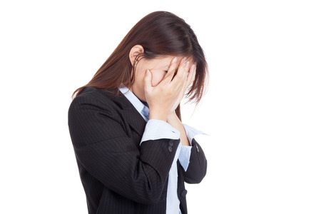 Sad young Asian businesswoman cry with palm to face  isolated on white backgroundの写真素材