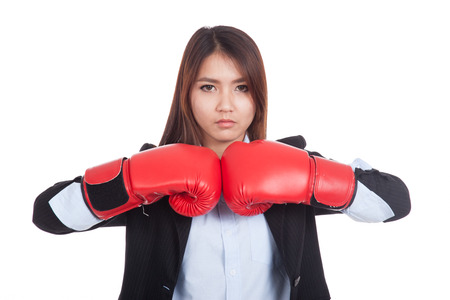 Young Asian businesswoman with boxing glove  isolated on white backgroundの写真素材