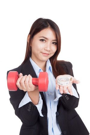 Young Asian businesswoman with red dumbbell and measuring tape  isolated on white backgroundの写真素材