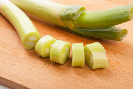 Chopped Leeks on wooden cutting board