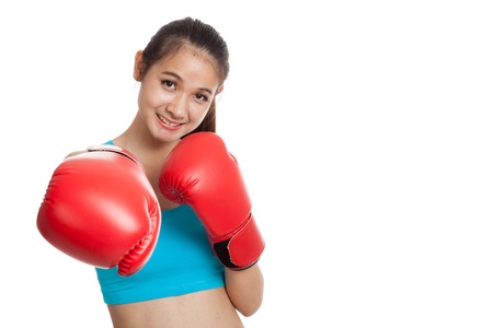Beautiful healthy Asian girl with red boxing glove  isolated on white background