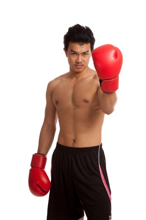 Muscular Asian man with red boxing glove  isolated on white backgroundの写真素材