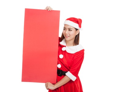 Asian Christmas girl with Santa Claus clothes with blank sign  isolated on white backgroundの写真素材