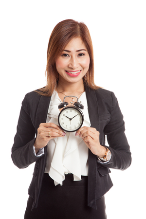 Young Asian business woman smile with a clock  isolated on white backgroundの写真素材