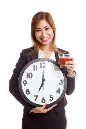 Young Asian business woman with tomato juice and clock  isolated on white backgroundの写真素材