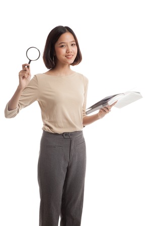 Asian business woman with a book and magnifying glass  isolated on white backgroundの写真素材