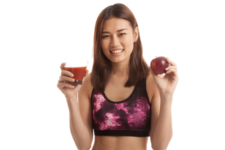 Beautiful healthy Asian girl with tomato juice and apple  isolated on white background.の写真素材