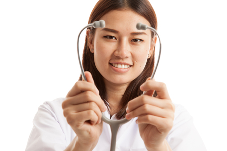 Young Asian female doctor show stethoscope focus at stethoscope  isolated on white background.の写真素材