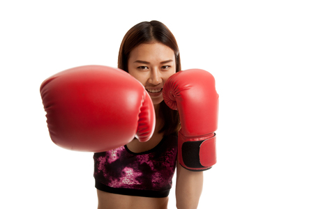 Beautiful healthy Asian girl with red boxing glove  isolated on white background.