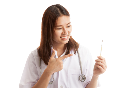 Close up young Asian female doctor with thermometer   isolated on white background.の写真素材