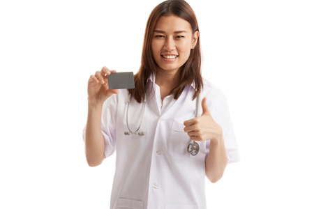 Asian young female doctor show thumbs up with blank card  isolated on white background.の写真素材