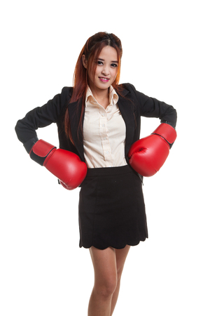 Young Asian business woman with red boxing gloves  isolated on white background.の写真素材