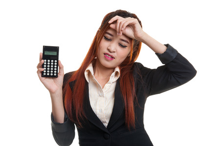 Asian business woman got  headache with calculator  isolated on white background.の写真素材