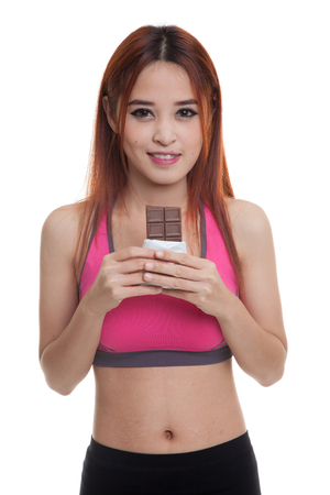 Beautiful healthy Asian girl love chocolate  isolated on white background.の写真素材