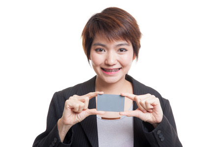 Young Asian business woman smile with blank card  isolated on white background.の写真素材