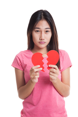 Beautiful young Asian woman with broken heart  isolated on white background.の写真素材