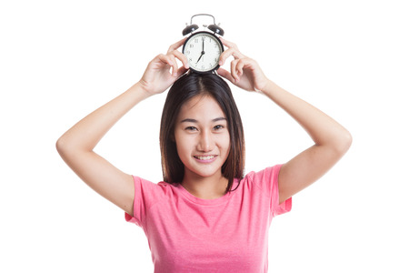 Young Asian woman smile with a clock  isolated on white background.