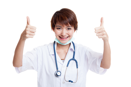Young Asian female doctor show two thumbs up  isolated on white background.の写真素材