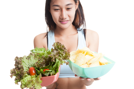 Close up Asian healthy girl salad and potato chips  isolated on white background.の写真素材