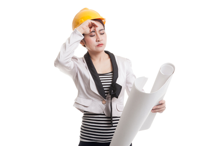 Tried Asian engineer woman with blueprints  isolated on white background.の写真素材