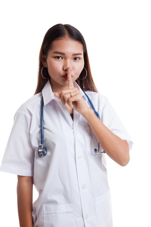 Asian young female doctor do quiet sign  isolated on white background.の写真素材